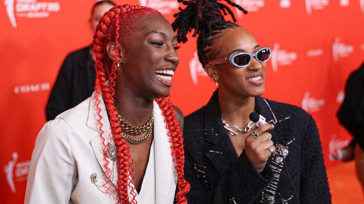 Saniya Rivers, left, and Aziaha James talk with media on the orange carpet before the 2025 WNBA Draft at The Shed at Hudson Yards.