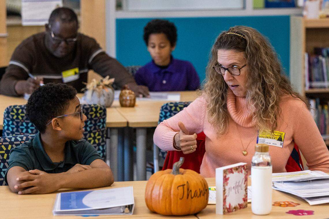 Volunteer tutor Gigi Waynewright-Baker and Nathaniel Grant, 10, take part in the new WakeTogether tutoring program designed to help Wake County elementary students recover from pandemic learning loss Thursday, Nov. 17, 2022 at Southeast Raleigh Elementary School.
