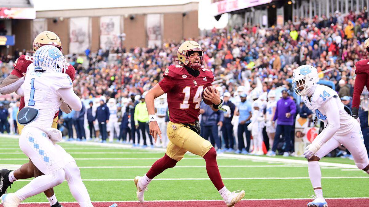 Boston College Eagles quarterback Grayson James (14) runs the ball for a touchdown against the North Carolina Tar Heels during the first half at Alumni Stadium.