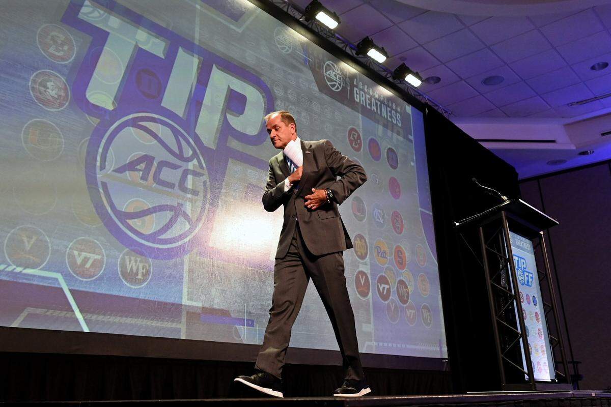 ACC Commissioner Jim Phillips walks off the stage after his speech to the media during the ACC Men’s TipOff event at the Hilton Charlotte Uptown Hotel on Wednesday, October 25, 2023 in Charlotte, NC.