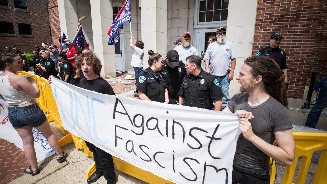 Tempers flare as pro-Confederate and anti-racist demonstrators clash in Chapel Hill