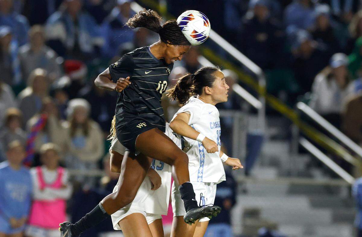 Wake Forest’s Malaika Meena (10) heads the ball over North Carolina’s Aria Nagai (19) during the first half of UNC’s game against Wake Forest in the finals of the 2024 Women’s College Cup at WakeMed Soccer Park in Cary, N.C., Monday, Dec. 9, 2024.