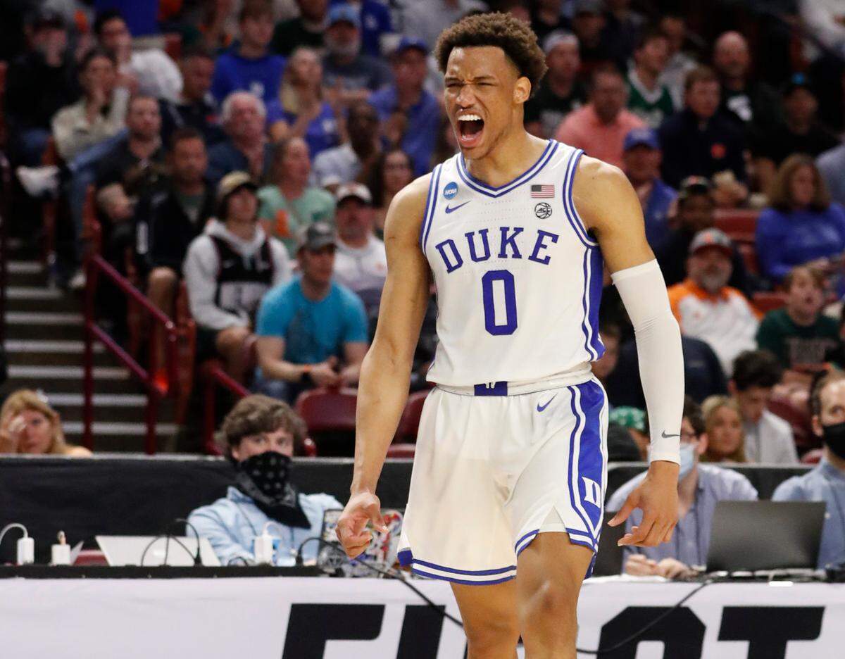 Duke’s Wendell Moore Jr. (0) celebrates after Paolo Banchero was fouled while making the basket during the second half of Duke’s 85-76 victory over Michigan State in the second round of the NCAA Tournament at Bon Secours Wellness Arena in Greenville, S.C., Sunday, March 20, 2022.