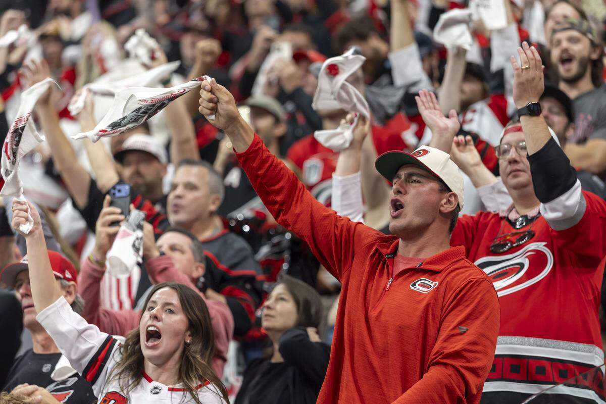 Carolina Hurricanes fans celebrate their 4-3 victory over Vegas in Game 2 of the Stanley Cup Final, on Thursday, June 4, 2026 at Lenovo Center in Raleigh, N.C.