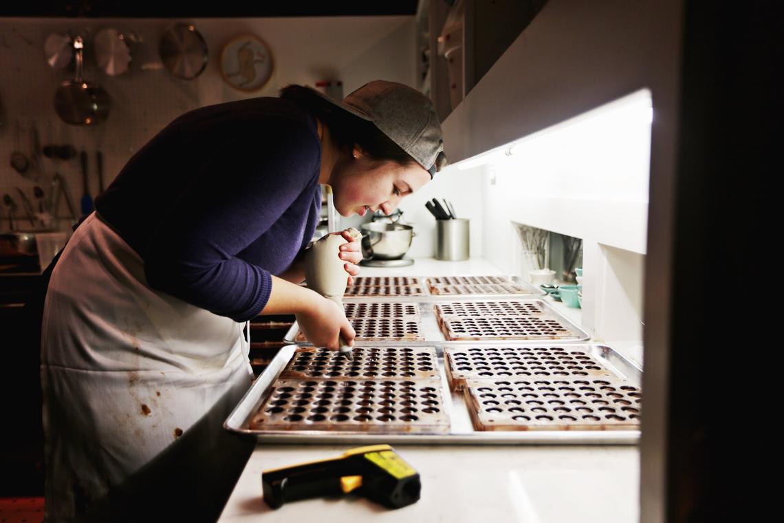 Videri Chocolate Factory confectioner Mary Kate Kornegay works on a batch of rosemary honey caramels on Friday morning, Oct. 26, 2018, in downtown Raleigh.