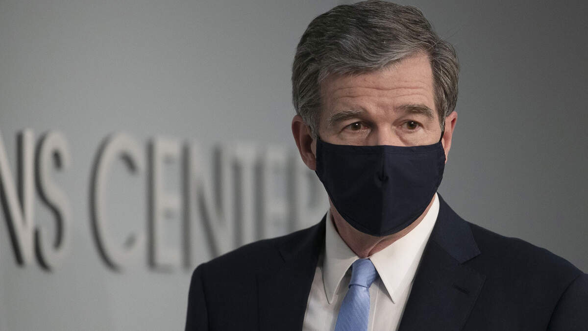 North Carolina Governor Roy Cooper arrives for a press briefing on the COVID-19 virus at the Emergency Operations Center on Thursday, June 18, 2020 in Raleigh, N.C.