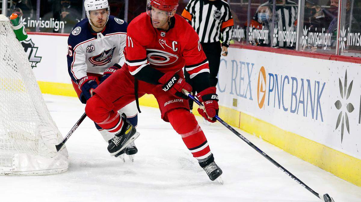 Carolina Hurricanes’ Jordan Staal (11) looks to pass the puck as Columbus Blue Jackets’ Jack Roslovic (96) challenges during the second period of an NHL hockey game in Raleigh, N.C., Monday, Feb. 15, 2021. (AP Photo/Karl B DeBlaker)