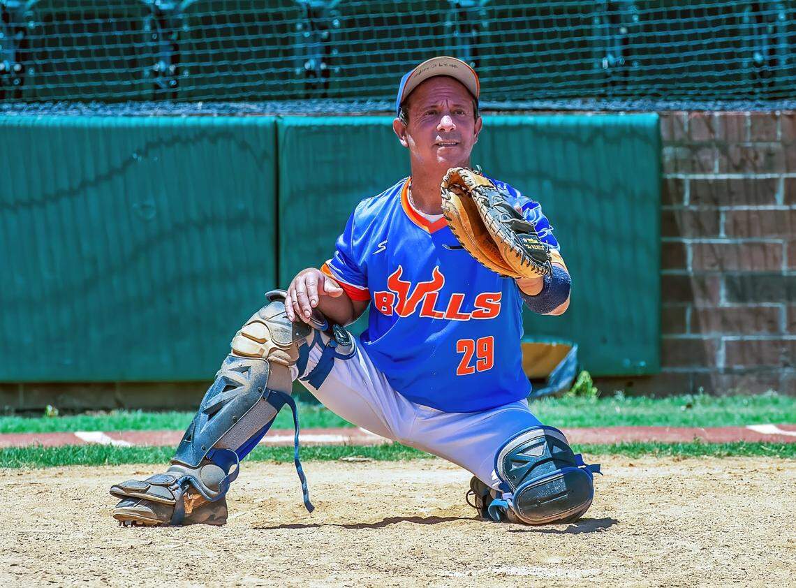Christian Lupo of Hope Mills, NC, behind the plate for the Bulls, of the Central North Carolina Men’s Senior Baseball League, after two double lung transplants.