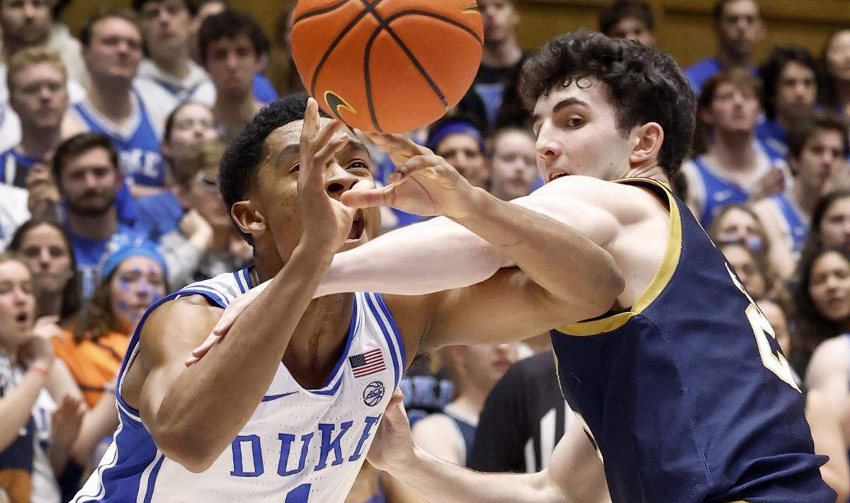 Duke’s Caleb Foster (1) is fouled by Notre Dame’s Logan Imes (2) during the second half of Duke’s 71-53 victory over Notre Dame at Cameron Indoor Stadium in Durham, N.C., Wednesday, Feb. 7, 2024.