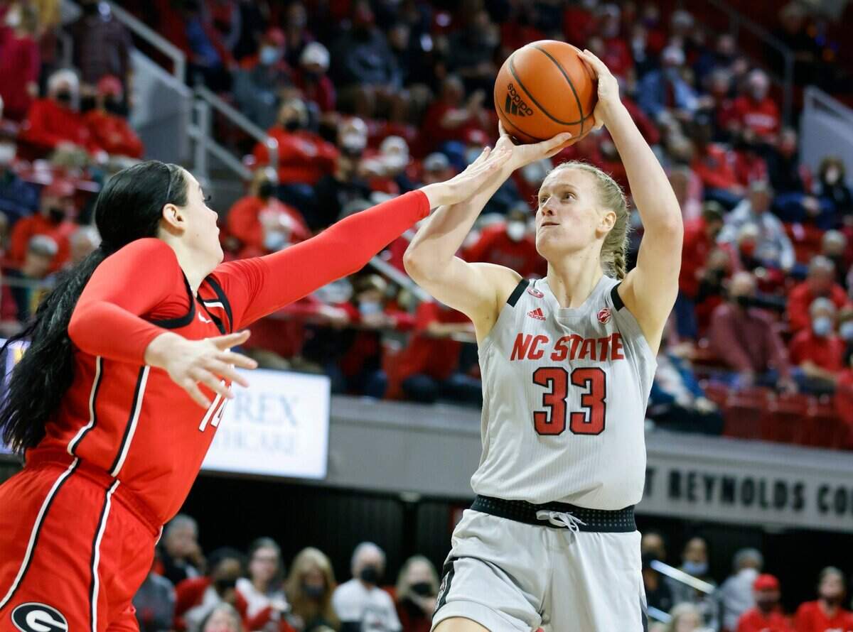 N.C. State’s Elissa Cunane (33) shoots as Georgia’s Jenna Staiti (14) defends during Georgias 82-80 overtime victory over N.C. State at Reynolds Coliseum in Raleigh, N.C., December 16, 2021.