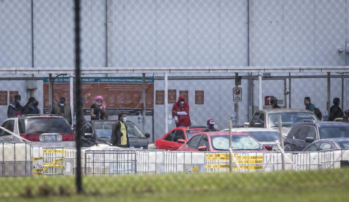 Smithfield Foods workers are seen at the processing plant in Tar Heel, N.C. around shift change on Thursday, May 7, 2020.