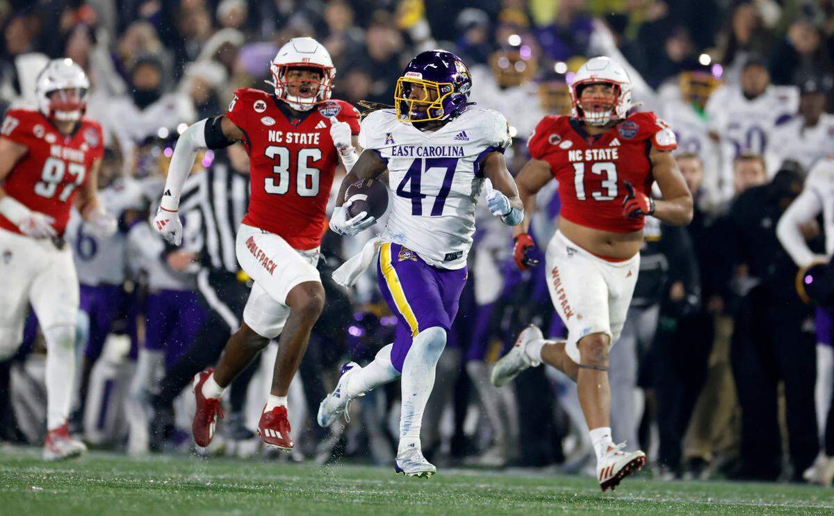 East Carolina running back Rahjai Harris (47) breaks free on a 86-yard touchdown run late in the second half of ECU’s 26-21 victory over N.C. State in the Military Bowl at Navy-Marine Corps Memorial Stadium in Annapolis, Md., Saturday, Dec. 28, 2024.