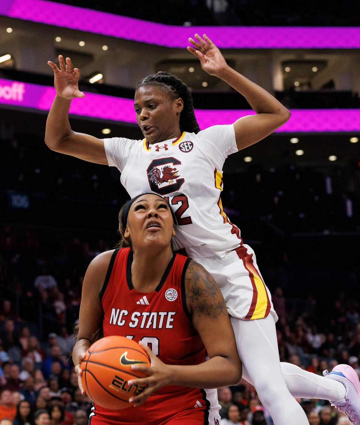 N.C. State’s Mallory Collier looks to shoot around South Carolina’s MiLaysia Fulwiley during the first half of the Wolfpack’s 71-57 loss on Sunday, Nov. 10, 2024, at Spectrum Center in Charlotte, N.C.