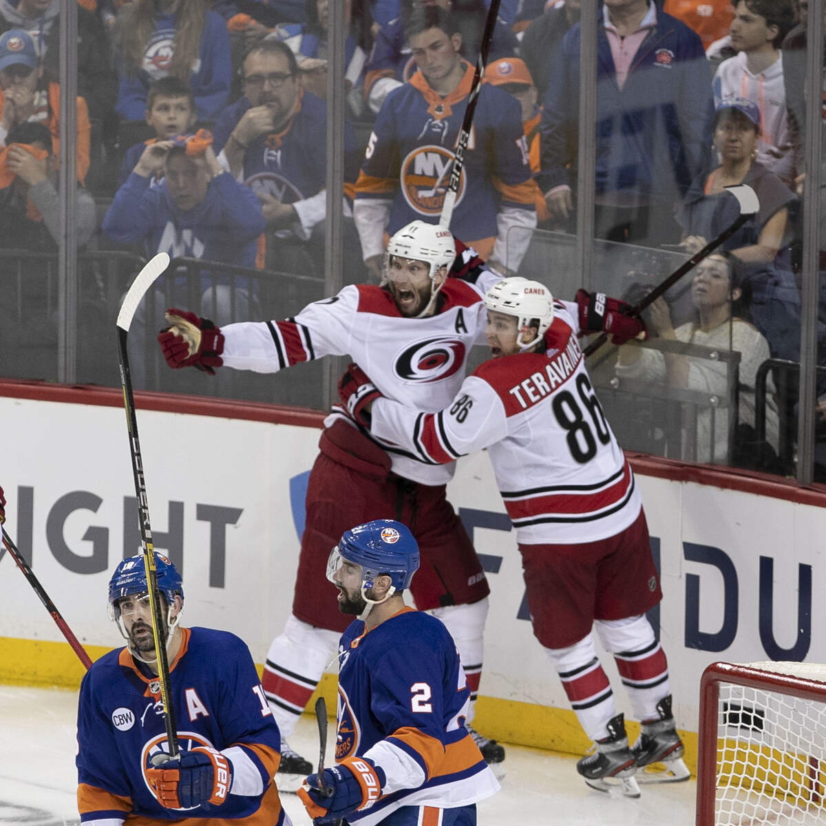 Carolina Hurricanes’ Jordan Staal (11) celebrates with Teuvo Teravainen (86) and Nino Niederreiter (21) as they celebrate their 1-0 overtime victory over the New York Islanders in Game 1 of the second round Stanley Cup series on Friday, April 26, 2019 at Barclays Center in Brooklyn, N.Y.