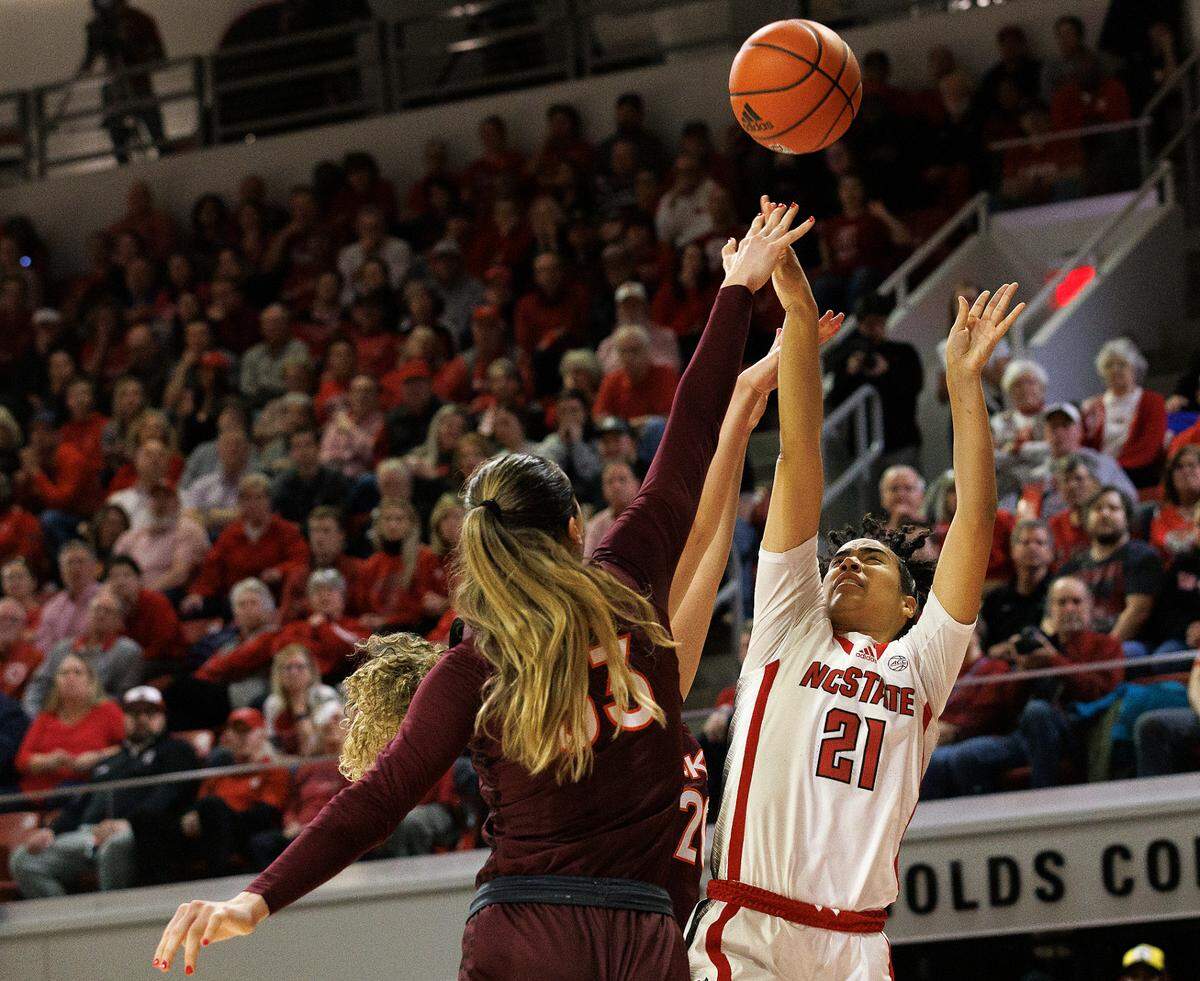 N.C. State’s Madison Hayes shoots over Virginia Tech’s Elizabeth Kitley and Olivia Summiel during the second half of the Wolfpack’s 72-61 loss on Thursday, Feb. 8, 2024, at Reynolds Coliseum in Raleigh, N.C.