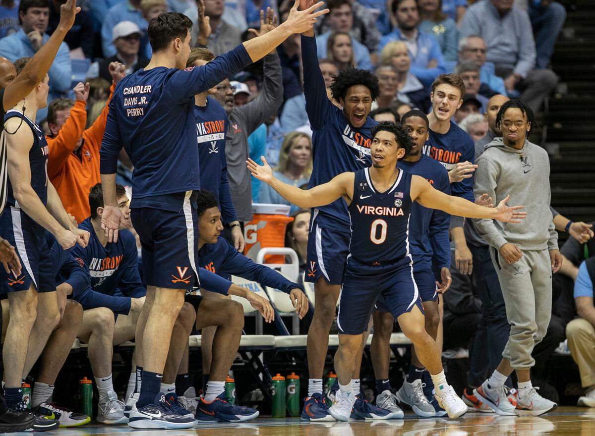 Virginia’s Kihei Clark (0) reacts after sinking a three point basket in the second half against North Carolina on Saturday, February 25, 2023 at the Smith Center in Chapel Hill, N.C.