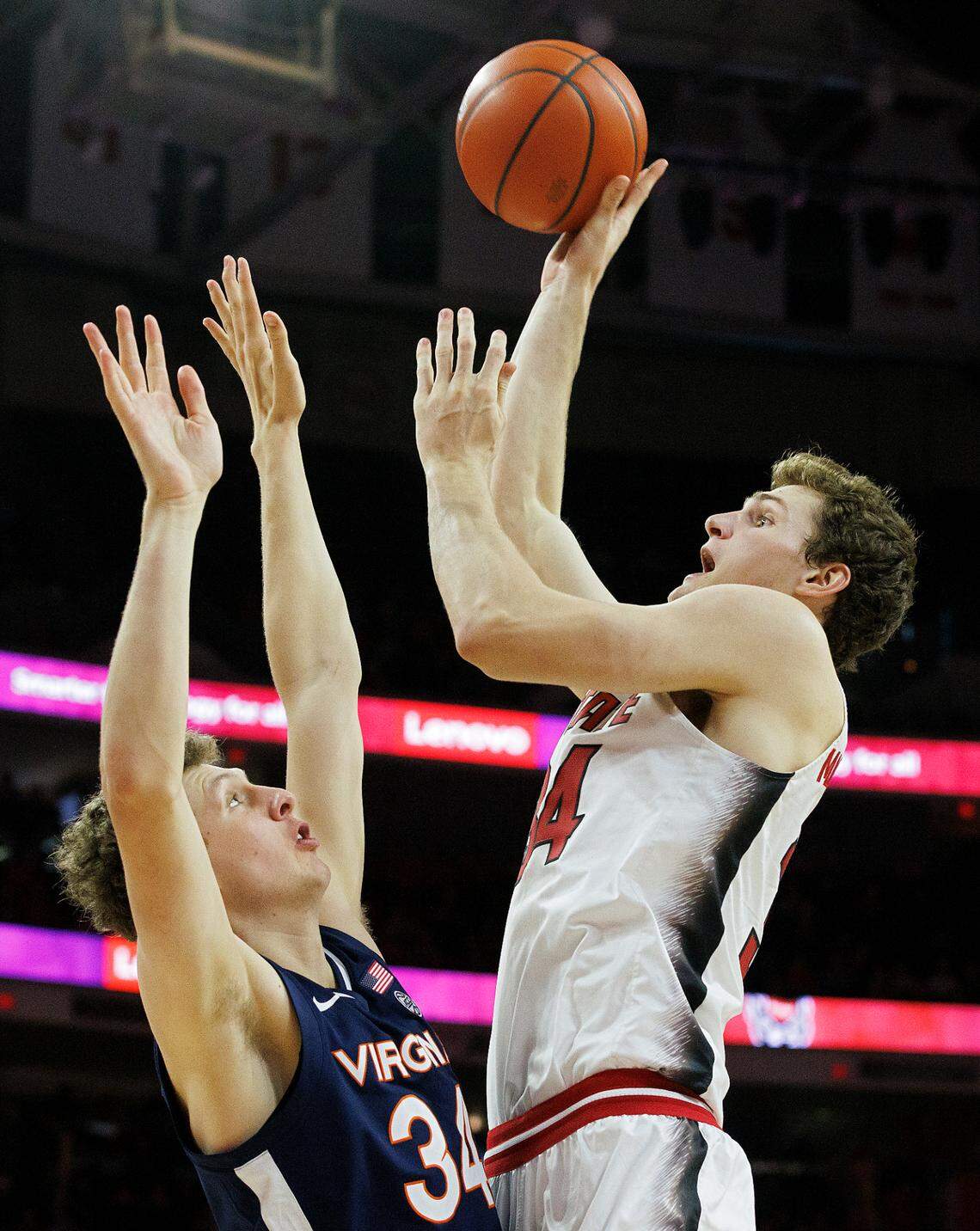 N.C. State’s Ben Middlebrooks shoots over Virginia’s Jacob Groves during the second half of the Wolfpack’s 76-60 win on Saturday, Jan. 6, 2024, at PNC Arena in Raleigh, N.C.