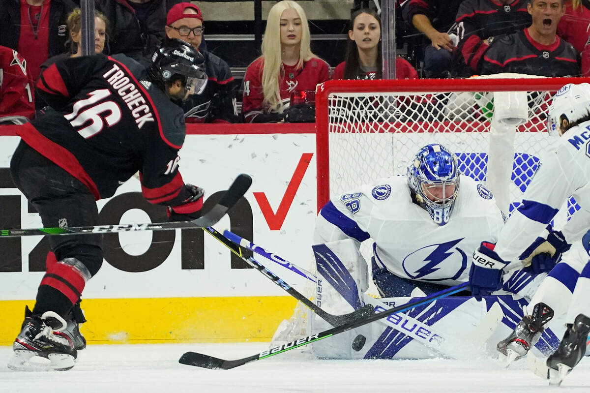 Tampa Bay Lightning goaltender Andrei Vasilevskiy (88) blocks against Carolina Hurricanes center Vincent Trocheck (16) during the first period in Game 1 of an NHL hockey Stanley Cup second-round playoff series in Raleigh, N.C., Sunday, May 30, 2021. (AP Photo/Gerry Broome)