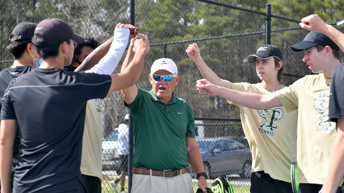 Enloe tennis team in a pre-match huddle with head coach Steve Spivey before their contest with Athens Drive. Enloe Tennis head Coach Steven Spivey gets his 1100th career victory with a win over Athens Drive High in Raleigh, N.C. on March 25, 2022.