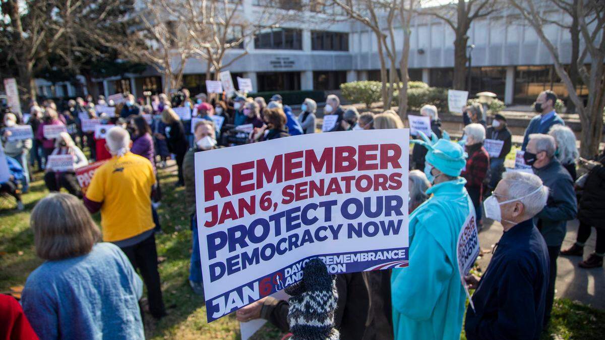 About 150 people demonstrated outside the Federal Building on New Bern Avenue in Raleigh on Jan. 6, 2022 on the one-year anniversary of the U.S. Capitol attack. Organized by the North Carolina Poor People’s Campaign, the protest urged lawmakers to pass the Freedom to Vote Act and the Protecting Our Democracy Act.