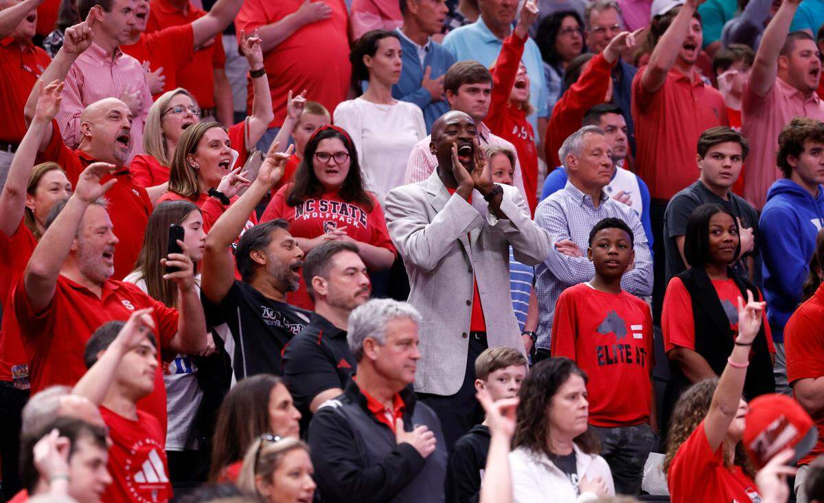 Wolfpack basketball great Julius Hodge cheers on N.C. State before the Wolfpack’s game against Duke in their NCAA Tournament Elite Eight matchup at the American Airlines Center in Dallas, Texas, Sunday, March 31, 2024.