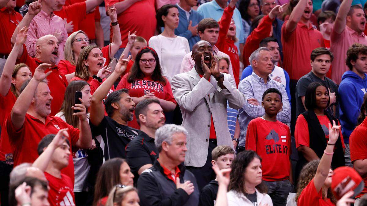 Wolfpack basketball great Julius Hodge cheers on N.C. State before the Wolfpack’s game against Duke in their NCAA Tournament Elite Eight matchup at the American Airlines Center in Dallas, Texas, Sunday, March 31, 2024.