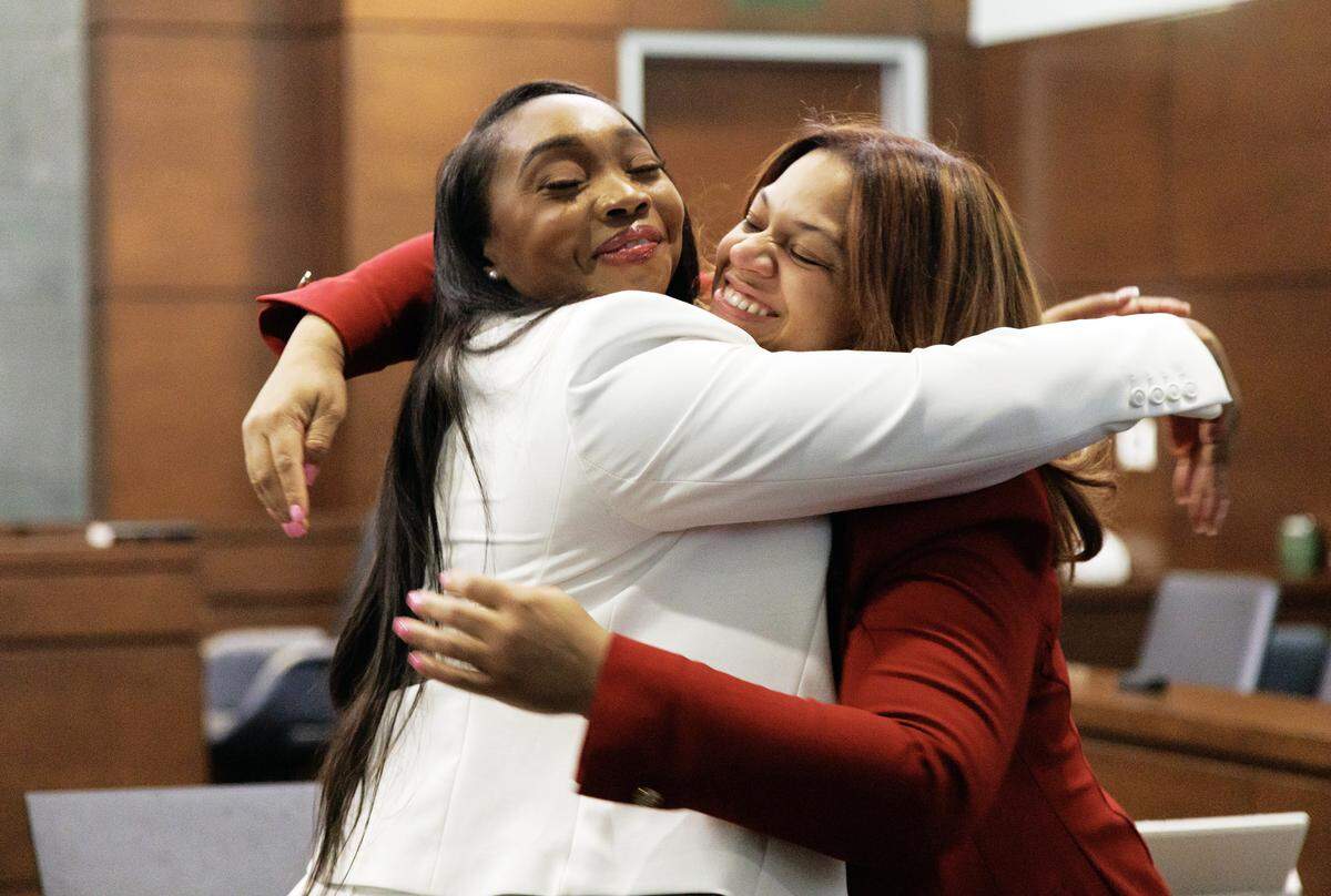 Akira Montague, right, embraces attorney Robonetta Jones following the jury’s verdict in her lawsuit against Brenay Kennard on Monday.