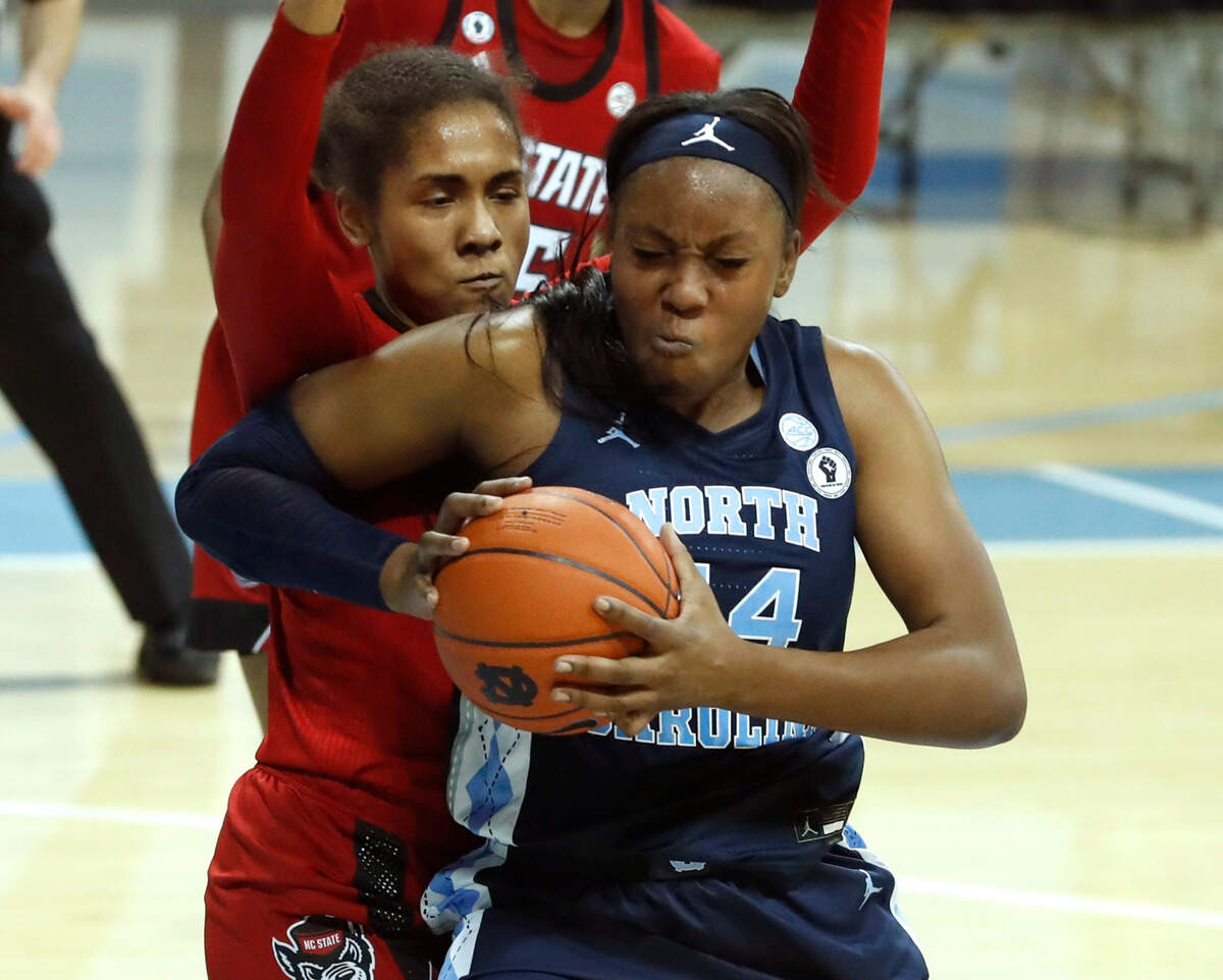 North Carolina’s Janelle Bailey (44) maneuvers around N.C. State’s Camille Hobby (41) during the second half of UNC’s 76-69 victory over N.C. State at Carmichael Arena in Chapel Hill, N.C., Sunday, February 7, 2021.