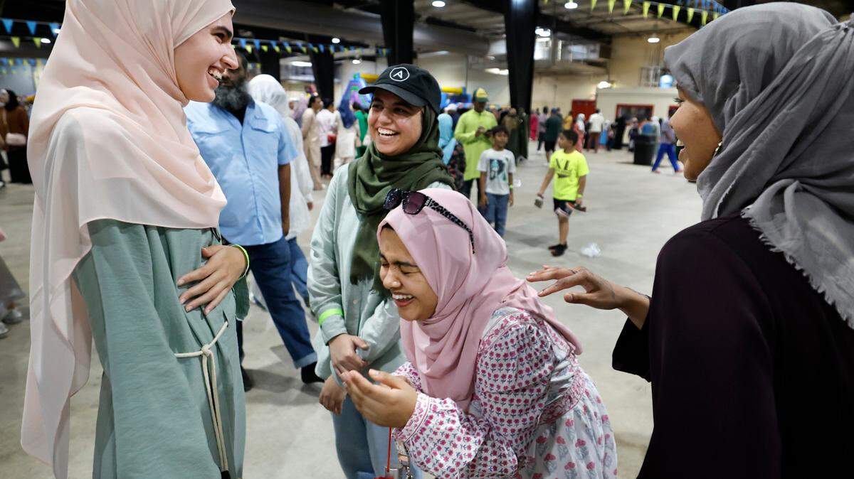 From left, friends Yasmine Lansari, Noor Bokhari, Sinthia Shabnam and Asma Idries have fun while attending the Eid Festival at the Jim Graham Building in Raleigh, N.C. Saturday, June 22, 2024. Eleven Triangle mosques and Islamic organizations joined forces to hold what was billed as North Carolina’s largest Eid festival.