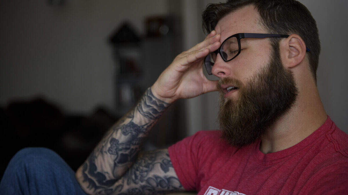 Mark Green recounts the mounting anxiety that he lived with  while he transitioned out of the military and into civilian life with the needs of a reliable car and a job suitable to his physical limitations. Green had enrolled in college level courses in the hopes of earning a higher wage. Green was photographed at his home on in Fayetteville, NC on June 11, 2019. [Melissa Sue Gerrits/For Carolina Public Press]