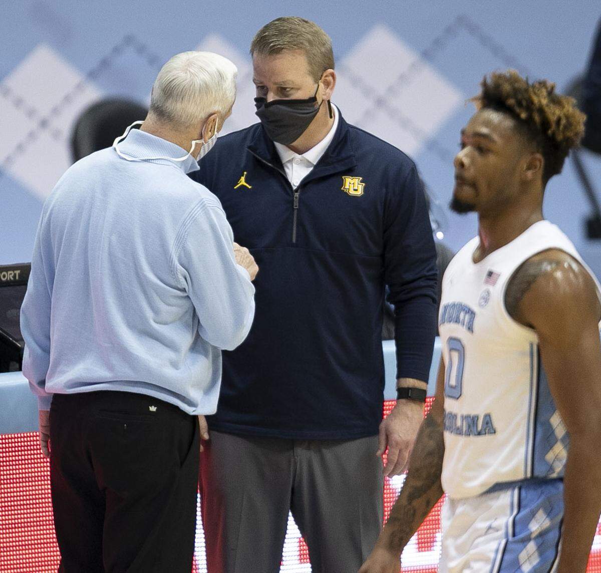 North Carolina coach Roy Williams congratulates Marquette coach Steve Wojciechowski following their 83-70 victory over North Carolina on Wednesday, February 24, 2021 at the Smith Center in Chapel Hill, N.C.