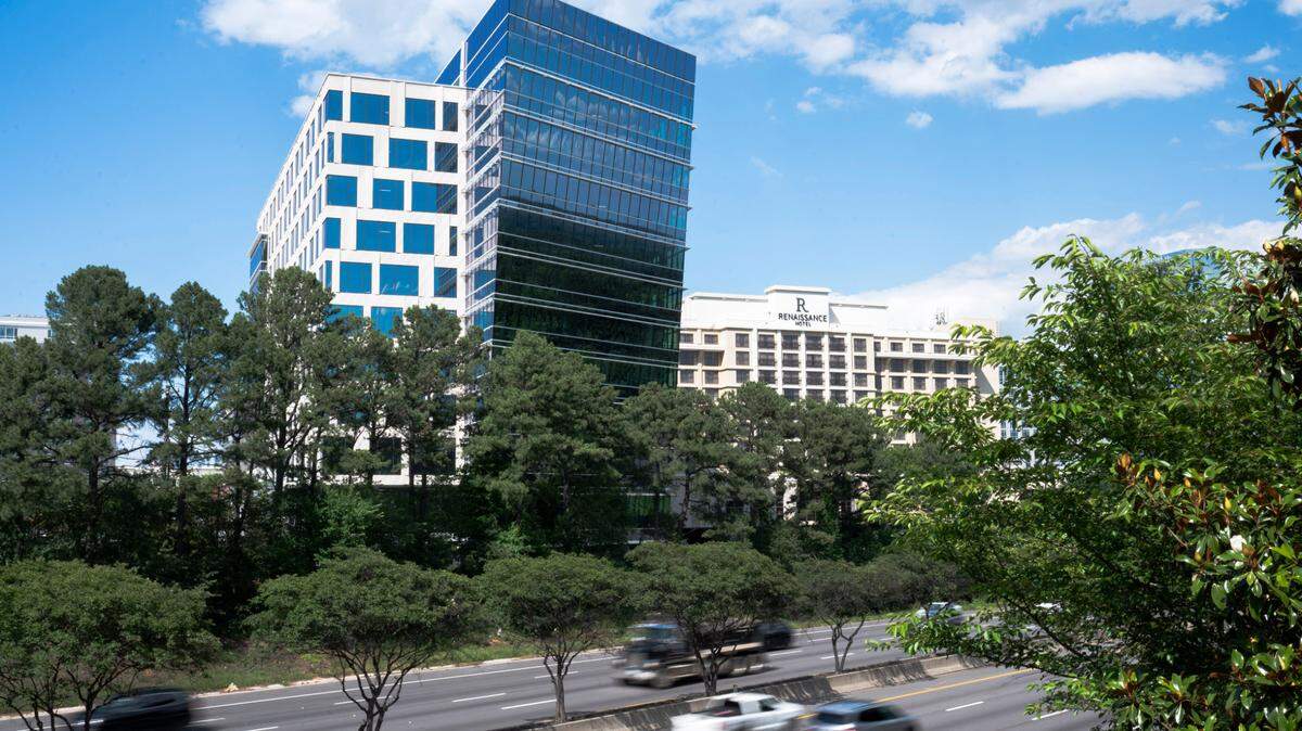 One North Hills Tower, a ten story office building, is pictured next to Interstate 440 on May 29, 2024. It's one of several developments changing Midtown Raleigh's skyline.