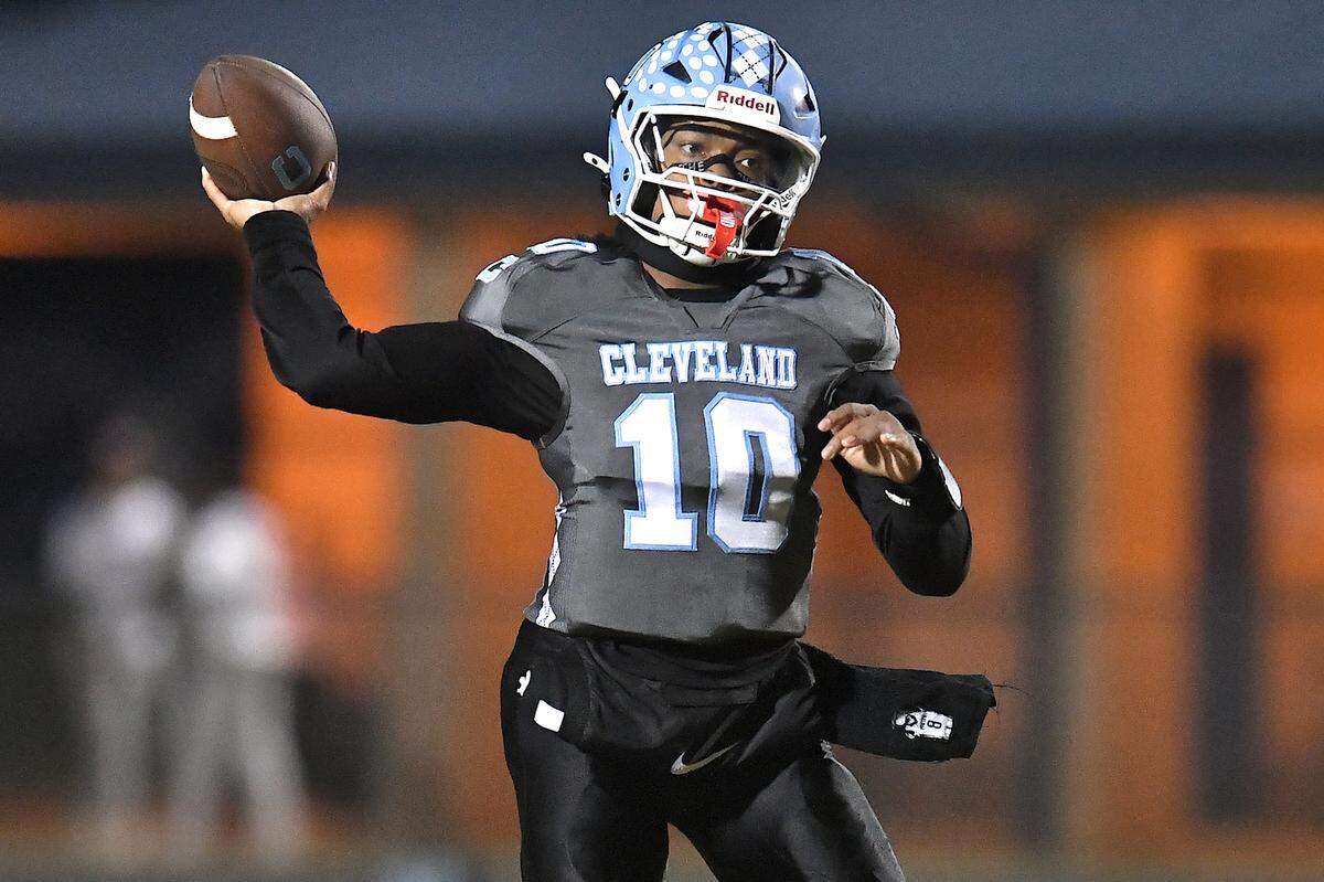 Cleveland quarterback Jackson Byrd (10) looks to pass downfield against Heritage during the first half. The Cleveland Rams and the Heritage Huskies met in the first round of the NCHSAA 4A playoffs in Clayton, N.C. on November 15, 2024.