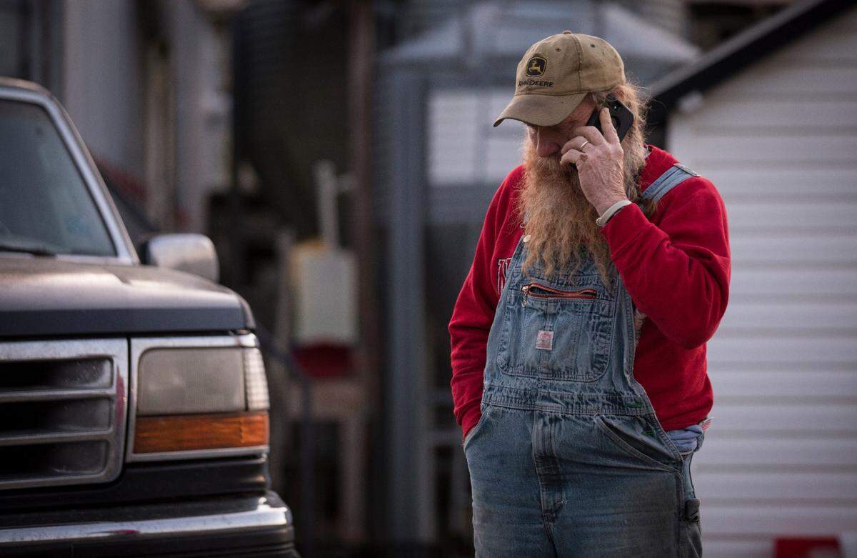 Randy Lewis, co-owner of the ?Ran-Lew Dairy Milk Company in Snow Camp, N.C., speaks to someone on the phone at 6:33 a.m. on Tuesday, April 14, 2020 about delivering a milk order. Delivering milk to local markets is not something Lewis normally does, but much of his business stopped when restaurants were closed for dining due to the coronavirus.