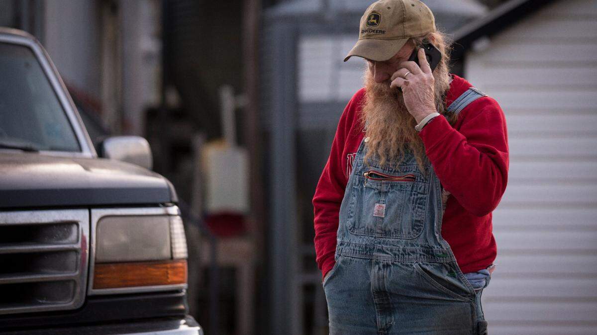 Randy Lewis, owner of the Ran-Lew Dairy in Alamance County., speaks to someone on the phone in 2020 about delivering a milk order. Lewis was in the pasture on his farm this month when a bull attacked him.
