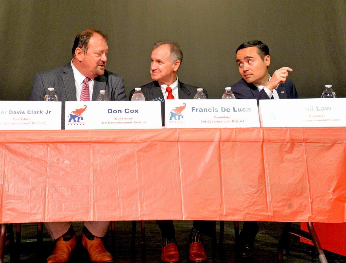 Republican 3rd Congressional District candidates (l-r) Don Cox, Francis De Luca and Phil Law chat during a forum for GOP candidates seeking their party’s nomination in the April 30 primary election, at Currituck County Middle School, Tuesday evening. Sixteen of the 17 candidates seeking to succeed the late Walter B. Jones in Congress attended the forum.