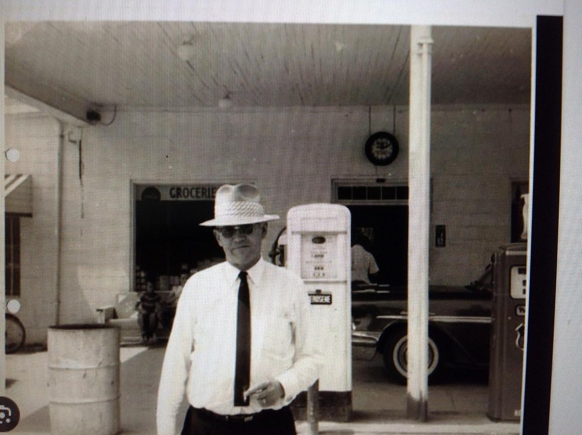 Bootleg liquor king Percy Flowers from Johnston County outside his country store and filling station.