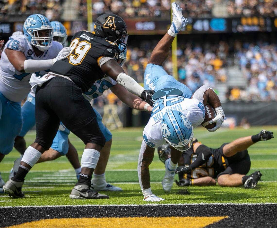 North Carolina’s Omarion Hampton (28) scores a touchdown on a two-yard run to give the Tar Heels a 49-35 lead in the fourth quarter on Saturday, September 3, 2022 at Kidd Brewer Stadium in Boone, N.C.