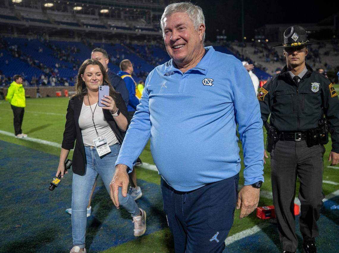 North Carolina coach Mack Brown smiles as he leaves the field following the Tar Heels’ 38-35 victory on Saturday, October 15, 2022 at Wallace-Wade Stadium in Durham, N.C.