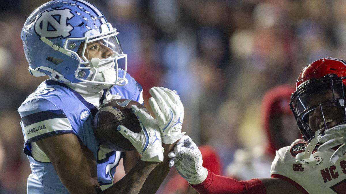 North Carolina receiver Chris Culliver (13) pulls in a 50-yard pass from quarterback Jacolby Criswell for a touchdown in the third quarter against N.C. State on Saturday, November 30, 2024 at Kenan Stadium in Chapel Hill, N.C.