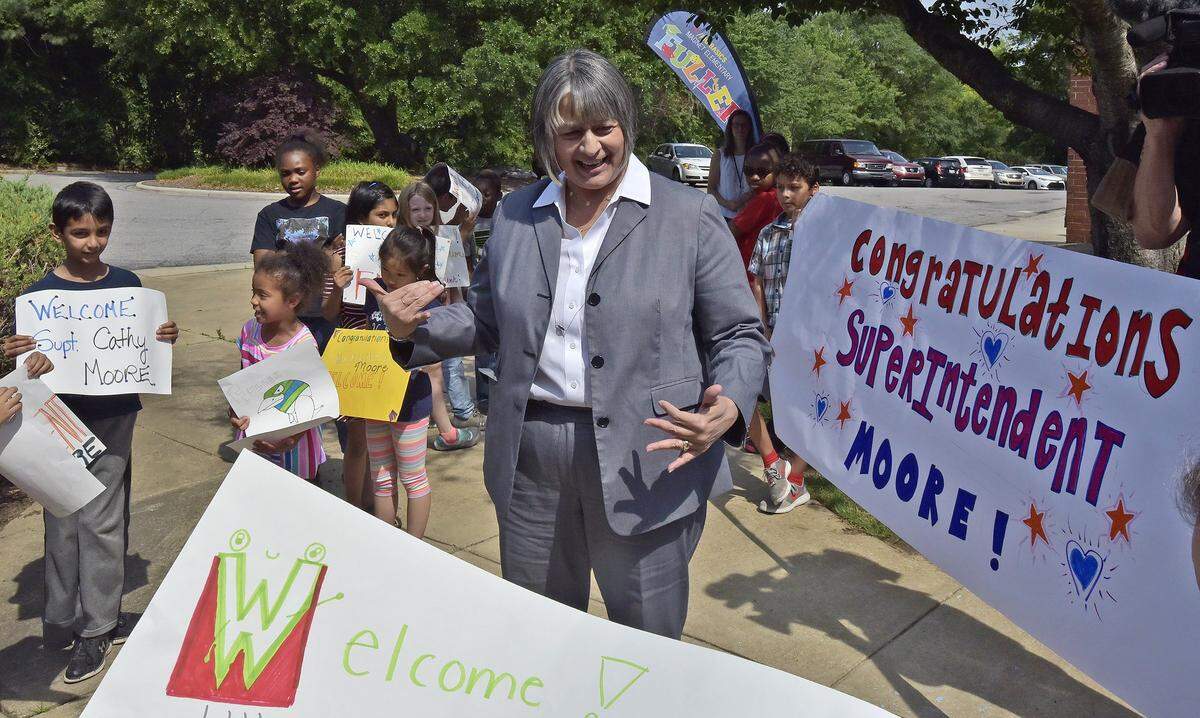 Wake County schools superintendent Catty Moore is greeted by students and faculty at Fuller Elementary School in this 2018 photo shortly after being named superintendent. Moore is retiring at the end of June 2023.