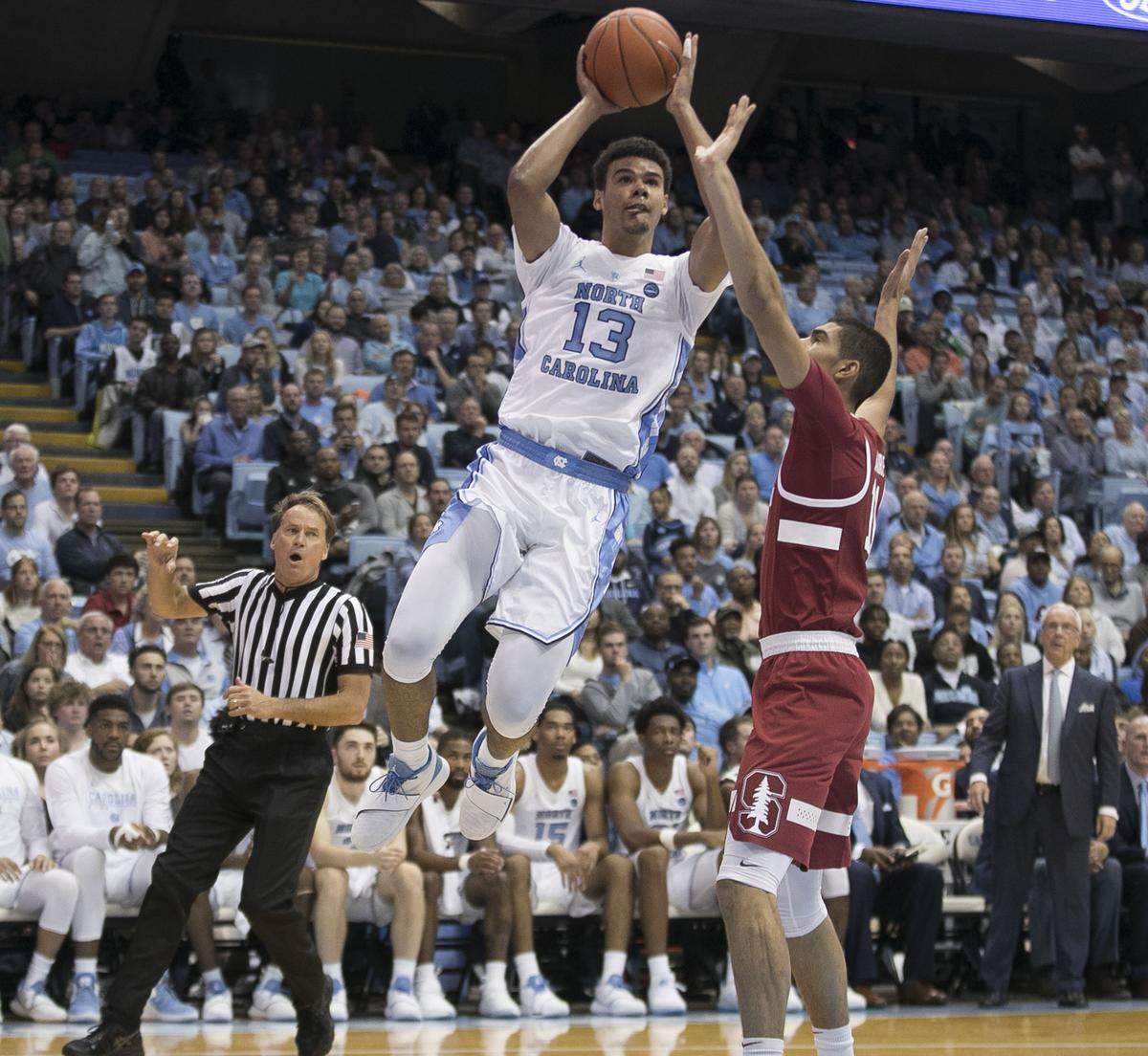 North Carolina’s Cameron Johnson (13) drives to the basket against Stanford’s Jaiden Delaire (11) during the second half on Monday, Nov. 12, 2018, at the Smith Center in Chapel Hill, NC. Johnson lead North Carolina with 17 points in the Tar Heels’ 90-72 victory.