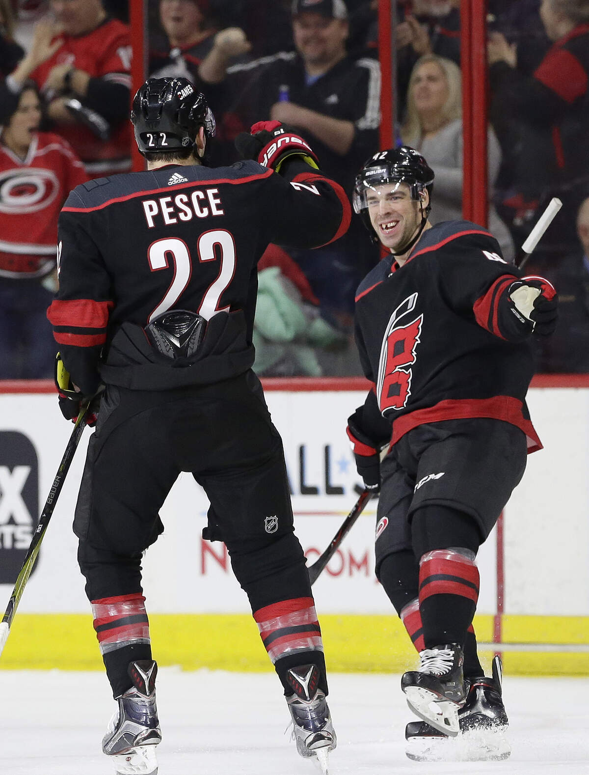 Carolina Hurricanes’ Greg McKegg, right, celebrates his goal against the Columbus Blue Jackets with Brett Pesce (22) during the second period of an NHL hockey game in Raleigh, N.C., Friday, Jan. 4, 2019.