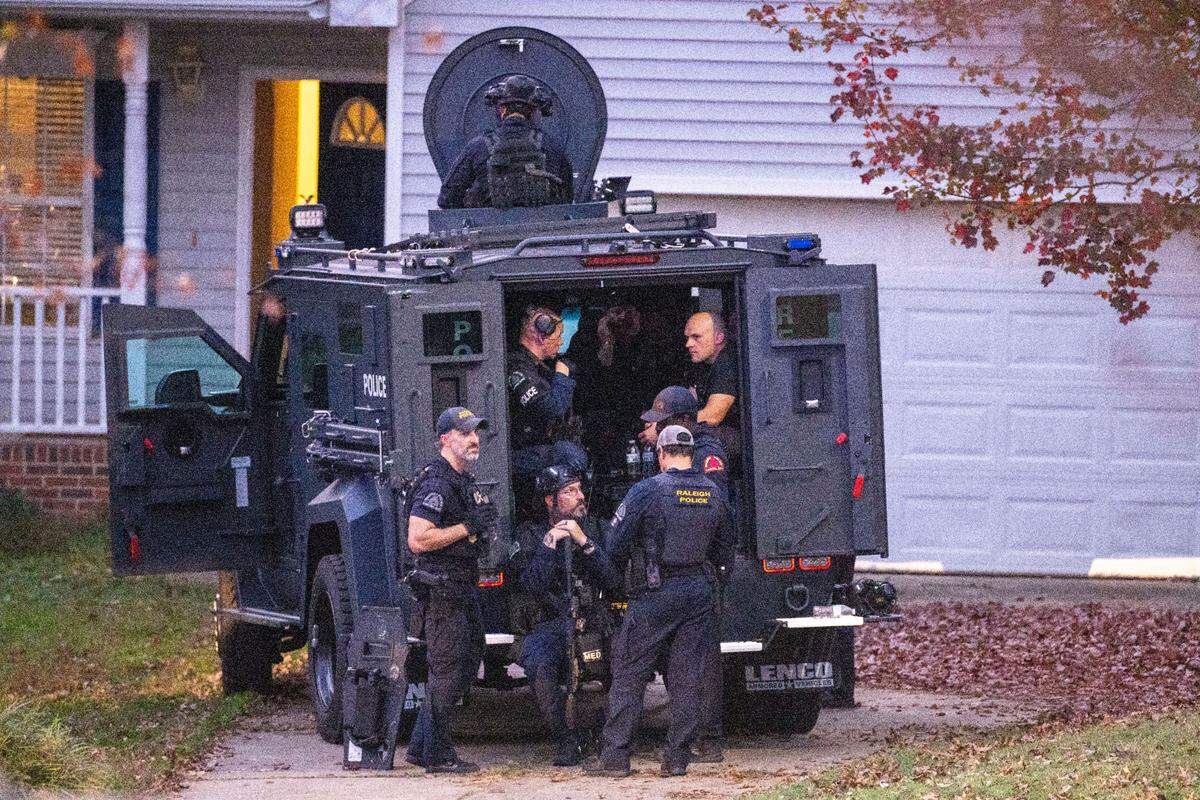 Raleigh Police work the scene where two “persons of interest” were detained Thursday afternoon on Kentford Court in Raleigh Thursday, Nov. 7, 2024. Raleigh police are investigating shots fired into eight cars and four houses, a growing total in the recent series of rush-hour shootings along Interstate 40 and near I-440.