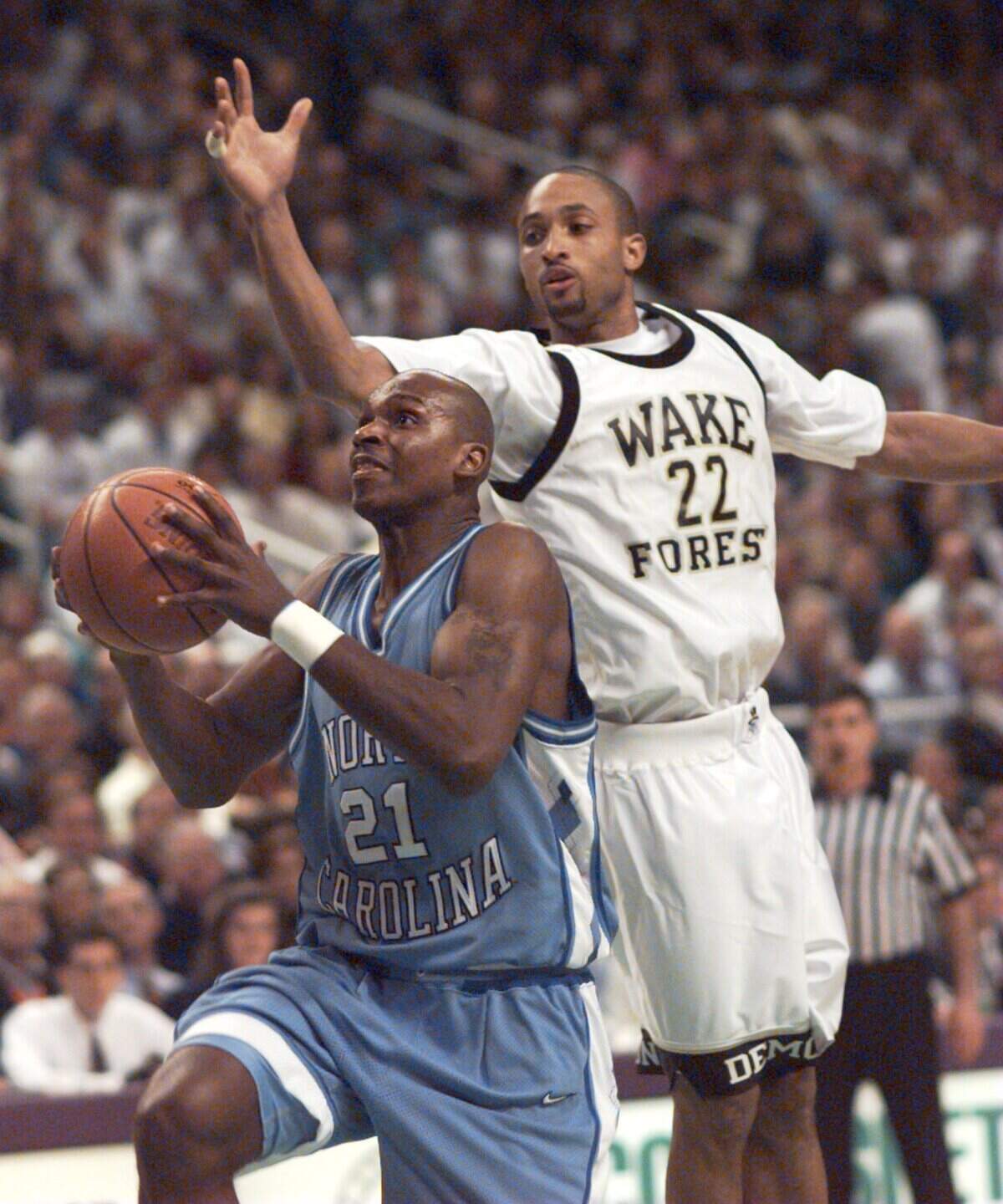 UNC-Chapel Hill’s Donald Williams slips by Wake Forest University’s Randolph Childress in this 1995 file photo from the ACC Tournament Championship Game.