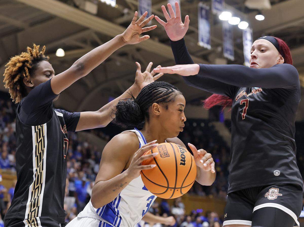 College of Charleston’s Taylor Barbot and Jami Hill pressure Duke’s Ashlon Jackson during the second half of the Blue Devils’ 81-64 first-round NCAA Tournament win on Friday, March 20, 2026, at Cameron Indoor Stadium in Durham, N.C.