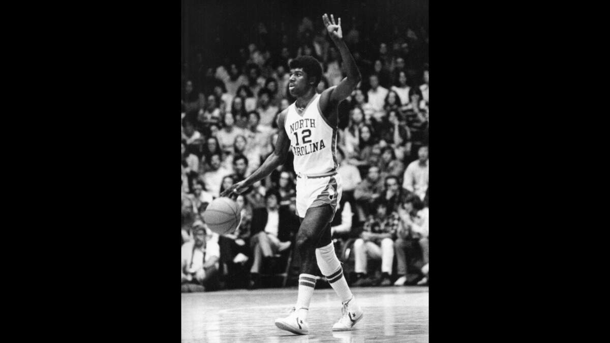 UNC’s Phil Ford signaling for the Four Corners offense in the 1970s.