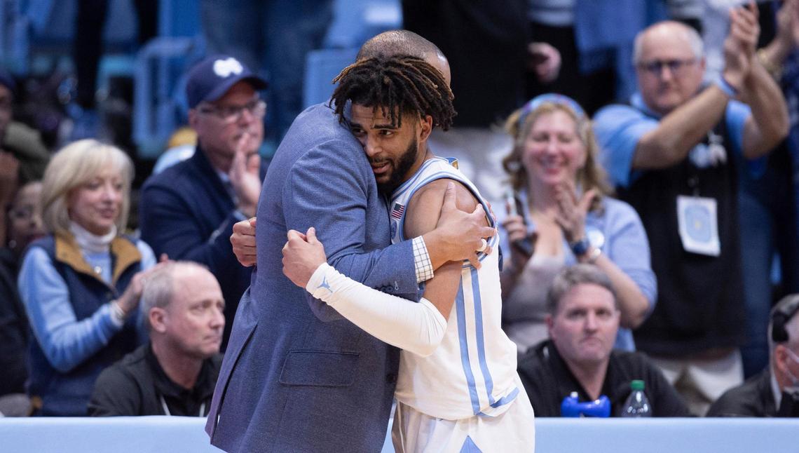 North Carolina coach Hubert Davis embraces R.J. Davis (4) as he comes out the game in the final minute of play after scoring a career high 36 points in the Tar Heels’ 85-64 victory over Wake Forest on Monday, January 22, 2024 at the Smith Center in Chapel Hill, N.C.