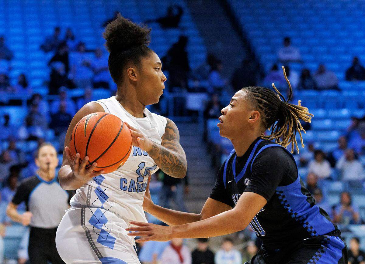 North Carolina’s Trayanna Crisp looks to drive around Kentucky’s Dazia Lawrence during the first half of the Tar Heels’ 72-53 win on Thursday, Dec. 5, 2024, at Carmichael Arena in Chapel Hill, N.C.