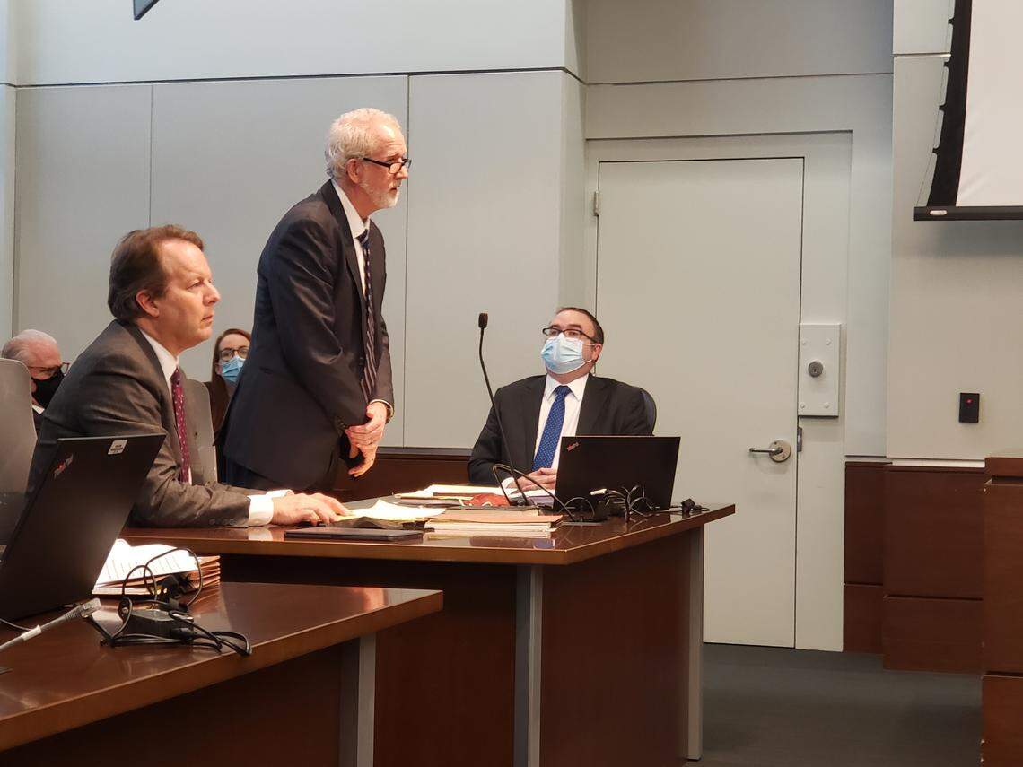 From left to right, Andrew McGann, James Hurst, and Jason Wilcox, all attorneys for Juul Labs, listen as Durham County Judge Orlando Hudson explained his ruling that included a judgment that he company violated state law thousands of times as part of discovery violations sanctions.